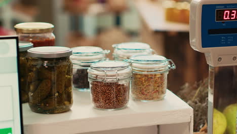 Cereals-and-grains-in-reusable-jars-placed-on-checkout-counter