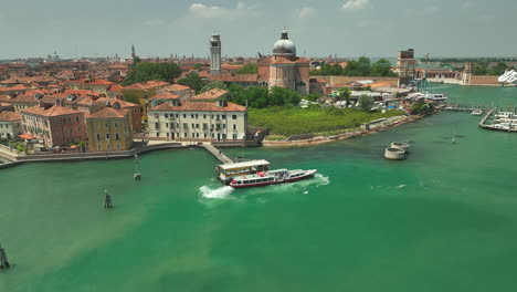 Venice-ferry-stop-Basilica-san-Pietro-di-Castello,-drone-truck-pan-4k