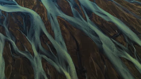 Flying-Close-To-Braided-Streams-Of-Glacial-River-In-Kálfafell,-Iceland