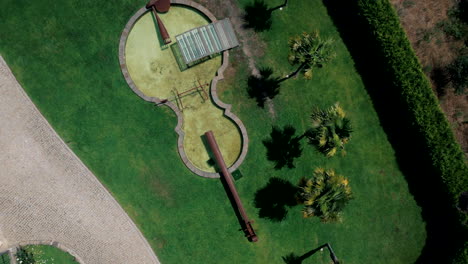 Aerial-top-View-of-Violin-Shaped-Lake-in-lush-mansion