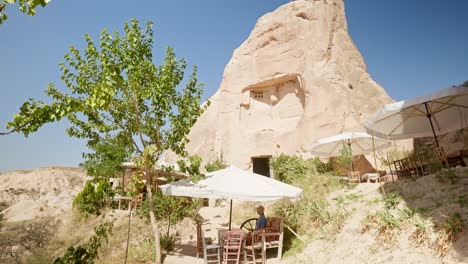 Remote-off-grid-open-air-cafe-hiker-rests-shade-Cappadocia-valley-trail
