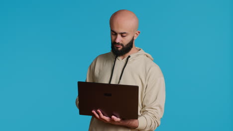 Middle-eastern-man-works-with-cyber-security-on-laptop