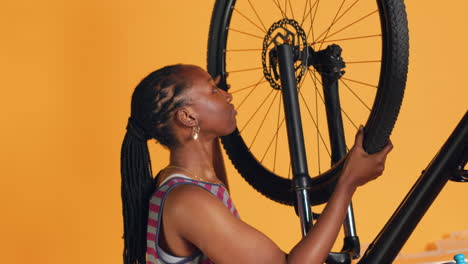Technician-fixing-faulty-bicycle-tires-and-servicing-damaged-rear-derailleur