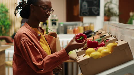 Shopper-choosing-freshly-harvested-vegetables-from-market