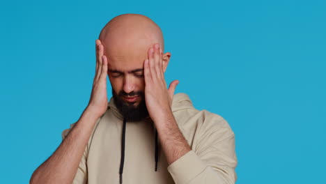 Muslim-man-suffering-from-serious-migraine-on-camera