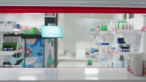 POV-of-retail-worker-arranging-pharmacy-products-on-shelves