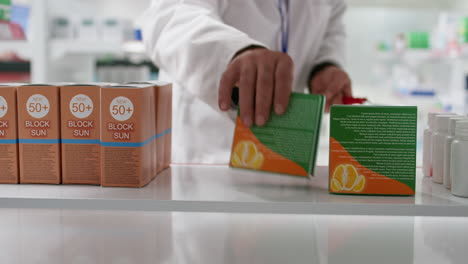 POV-of-druggist-taking-nutritional-vitamins-boxes-from-shelves