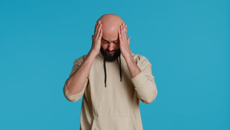 Muslim-man-suffering-from-serious-migraine-on-camera