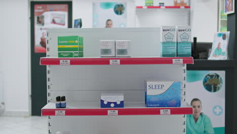 Empty-drugstore-shelves-filled-with-medical-supplies-and-pills
