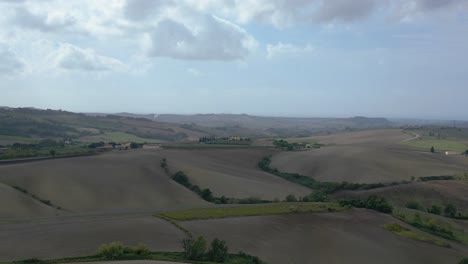 Stunning-aerial-top-view-flight-meditative-LandscapeTuscany-Wine-field-valley-Italy-fall