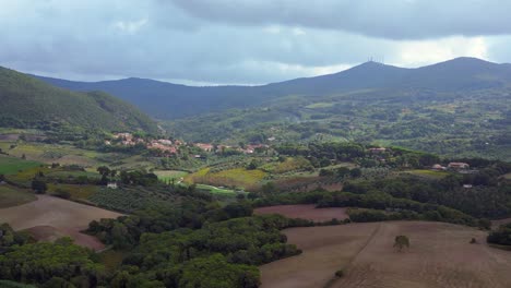Nice-aerial-top-view-flight-Tuscany-meditative-valley,-village-Italy-fall-23