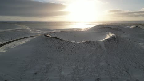 A-giant-snowy-crater-in-the-north-of-Iceland-during-the-winter,-aerial