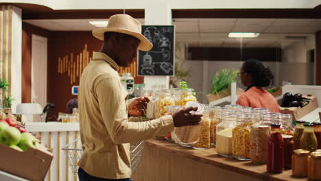 Client-examines-cereals-and-grains-at-zero-waste-eco-store