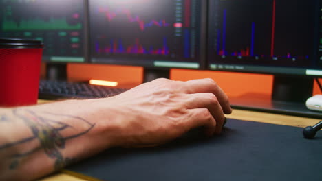 Male-Trader-Uses-and-Clicks-Computer-Mouse-Analyzes-Exchange-Market-Charts
