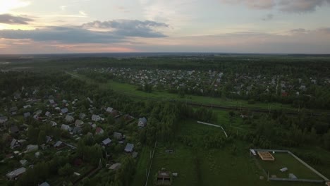 Russian-village-and-moving-cargo-train-aerial-view