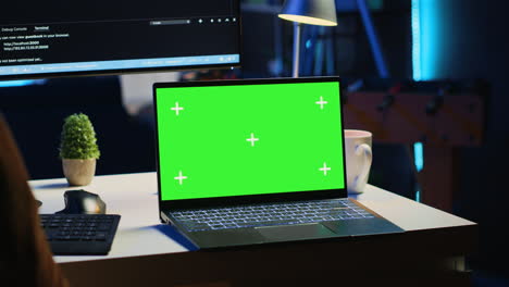Green-screen-laptop-in-home-office-used-for-developing-software-applications