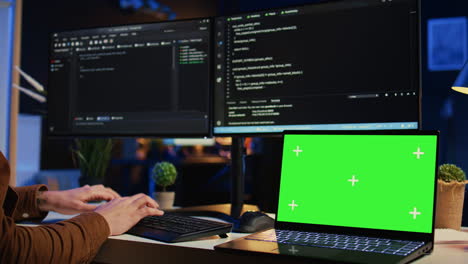 Green-screen-laptop-in-home-office-used-for-developing-software-applications