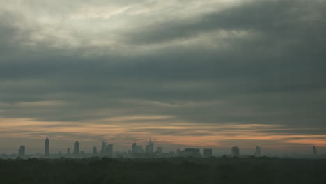 Timelapse-of-sun-rising-in-overcast-sky-over-the-city