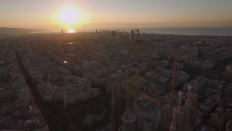 Flying-over-Barcelona-and-Sagrada-Familia-at-sunset