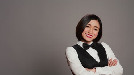 Asian-woman-hotel-concierge-wearing-elegant-uniform-with-bow