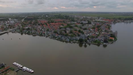 Flying-over-riverside-township-in-Netherlands