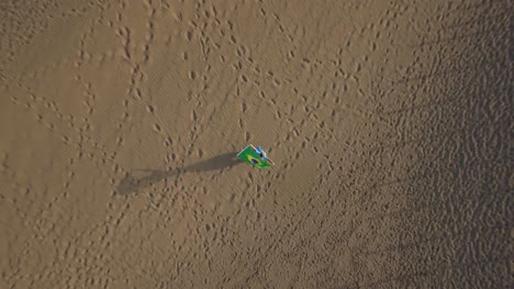 Flying-over-woman-with-Brazilian-flag-on-the-ocean-coast