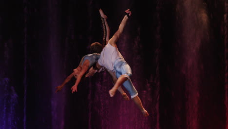 Couple-performing-aerial-acrobatics
