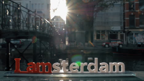 I-amsterdam-slogan-and-city-view-with-canal