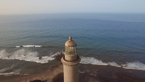 Flying-over-Maspalomas-Lighthouse-and-ocean