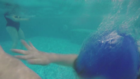 Kid-swimming-breaststroke-in-the-pool