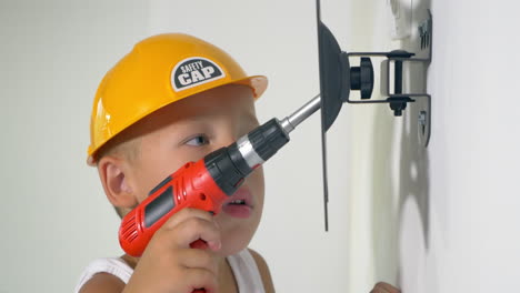 Child-playing-a-repair-at-home