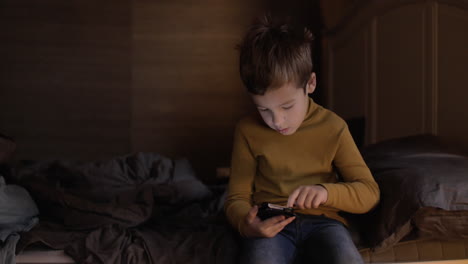 Kid-with-smart-phone-at-home