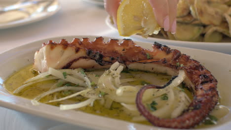 Eating-fried-octopus-in-restaurant