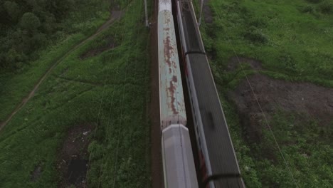 Aerial-bird-eye-view-of-two-railway-different-direction-and-moving-trains-Russia
