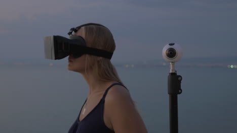 Woman-in-VR-headset-and-360-degree-camera