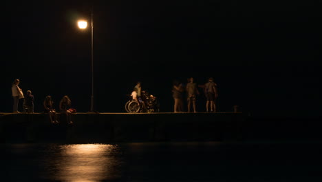 Timelapse-of-people-on-the-pier-at-night