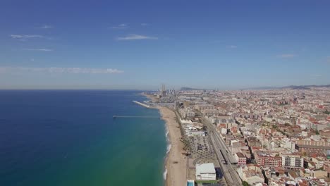 Aerial-view-of-beach-sea-railways-and-hotels-Barcelona-Spain