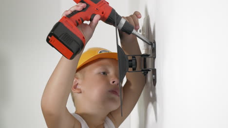 Boy-working-with-electric-screwdriver