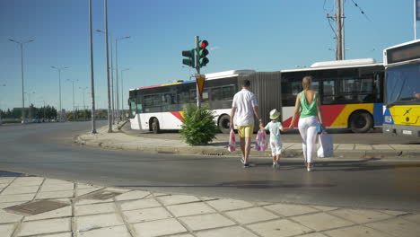 Family-with-shopping-bags-crossing-the-road