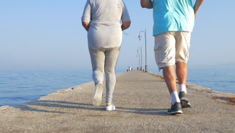 Senior-couple-jogging-on-the-pier