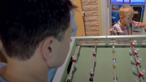 Father-and-Son-Playing-Foosball-in-Arcade
