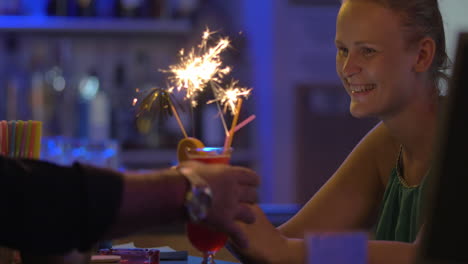 Woman-with-Smartphone-Ordered-Cocktail-with-Sparkler