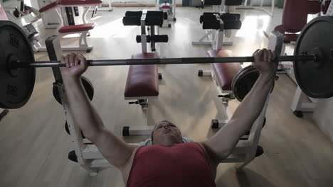 Mature-man-doing-chest-press-exercise