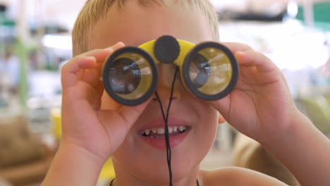 Child-looking-through-the-binoculars