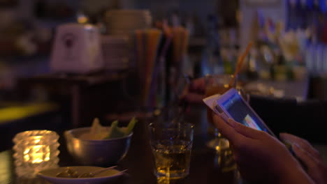 Tablet-in-Hands-and-Bar-Counter