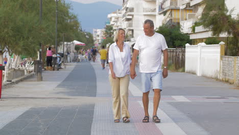 Couple-of-man-and-woman-walking-down-the-street