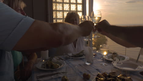 People-toasting-during-dinner-on-the-balcony