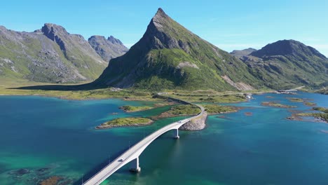 Cars-Drive-Lofoten-Islands-Bridge-and-Scenic-Route-in-Norway,-Scandinavia---Aerial