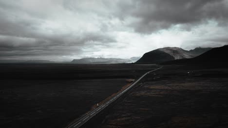 Cinematic-aerial-ring-road-in-iceland-distant-volcanic-mountain-range-landscape-scenery