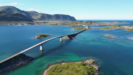 Lofoten-Islands-Bridge-and-Scenic-Route-across-Turquoise-Blue-Water-in-Norway,-Scandinavia---Aerial